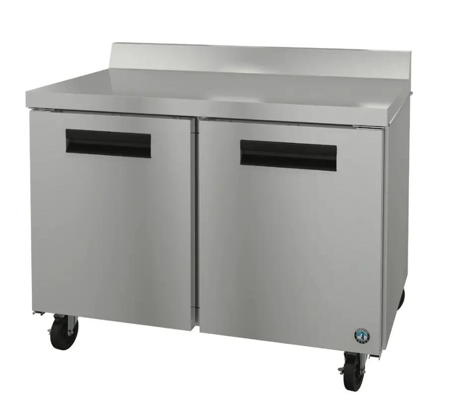 Alt-text: Stainless steel commercial refrigerator with two doors and wheels, representing a project completed by Mid America.
