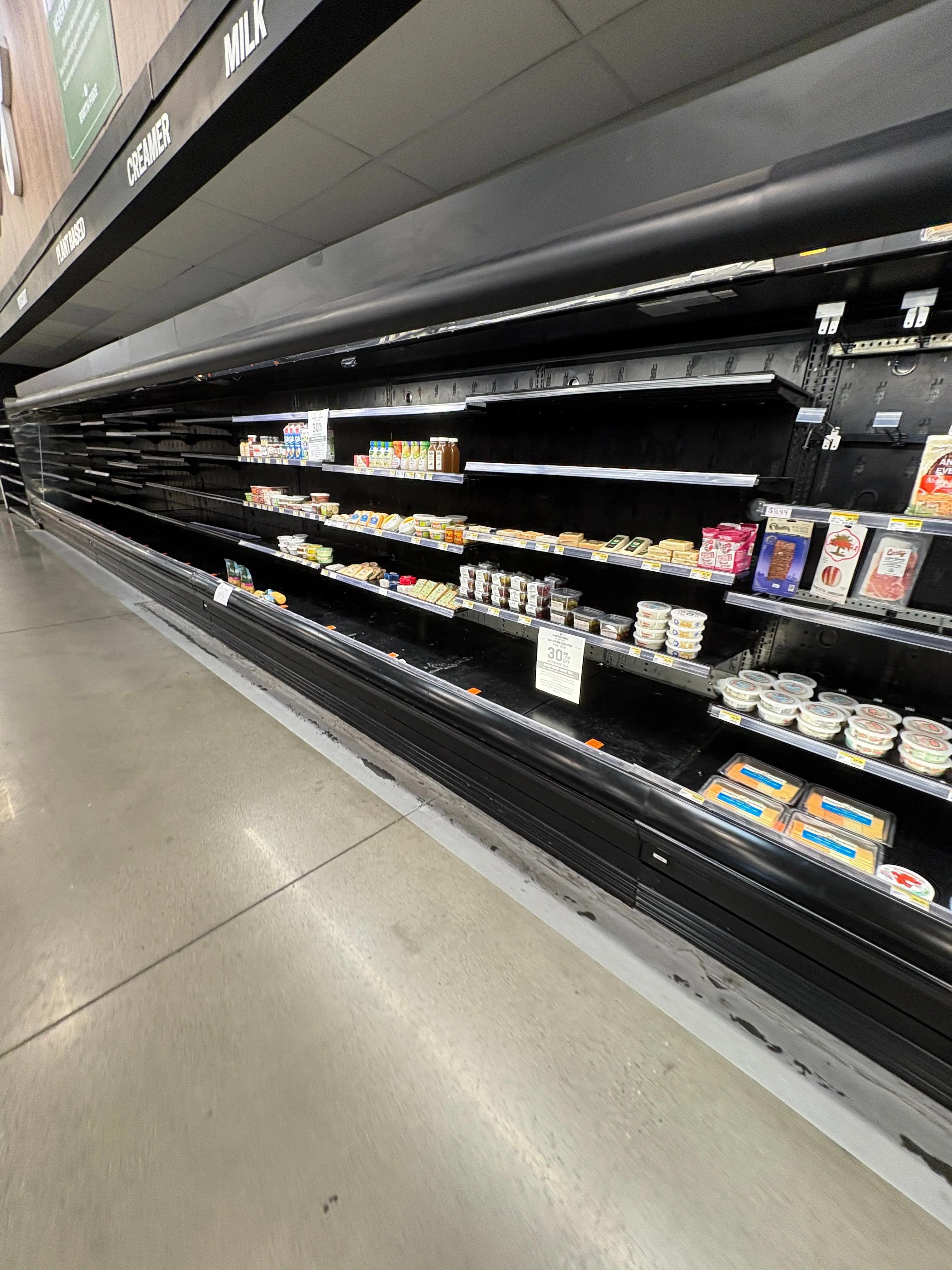 Open refrigerated merchandiser from grocery store, commercial dairy and fresh food display case available through Mid-America Store Fixtures