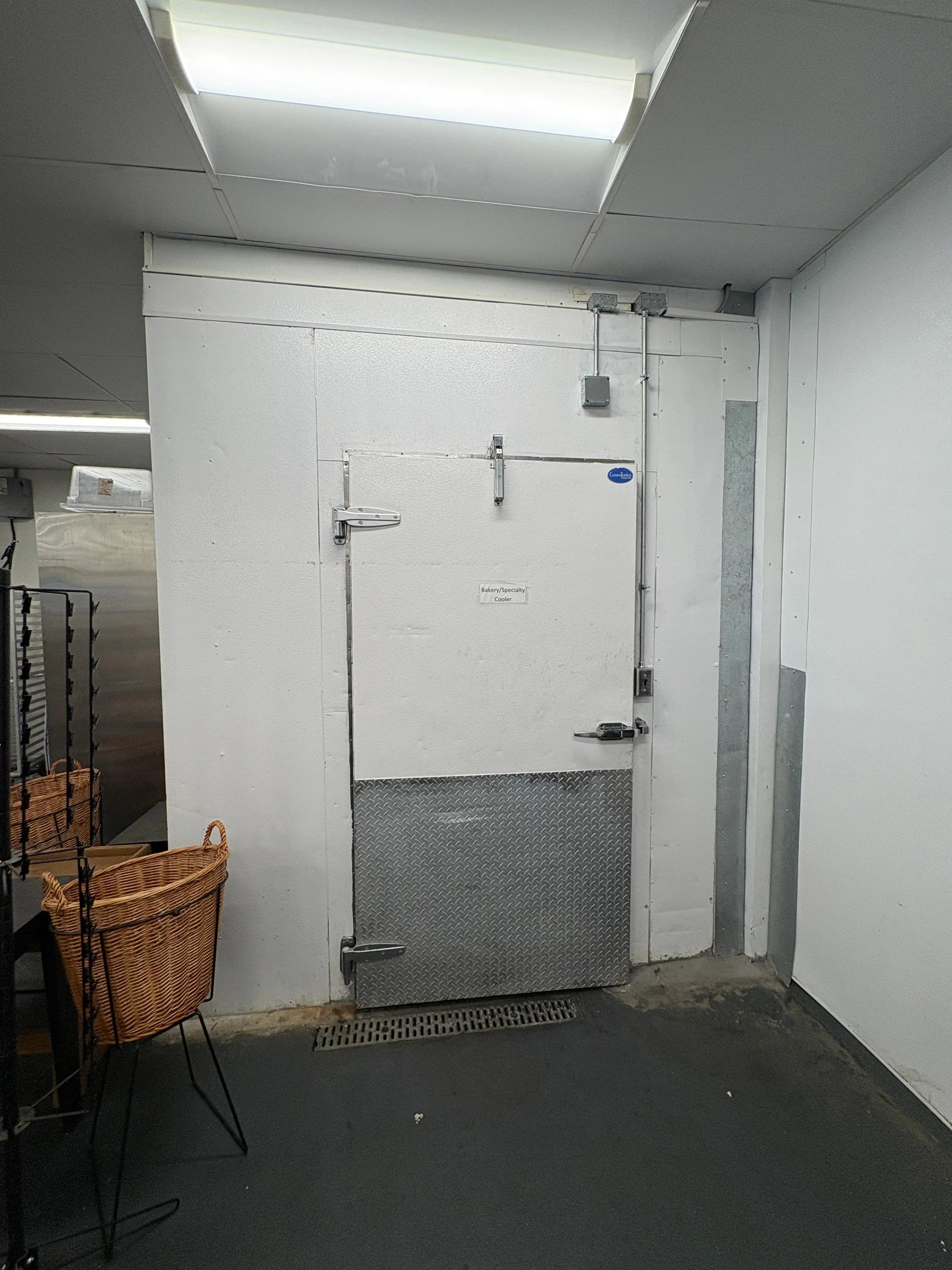 Walk-in cooler or freezer exterior door from a commercial food distribution facility, available through Mid-America Store Fixtures