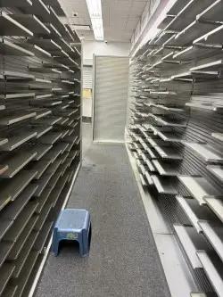 Lozier pharmacy shelving with narrow adjustable shelves for prescription storage and retail organization